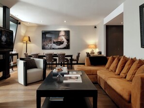 Grand Suite (Grand Place) | Living area | Flat-screen TV - The Dominican, Brussels, a Member of Design Hotels (Brussels)