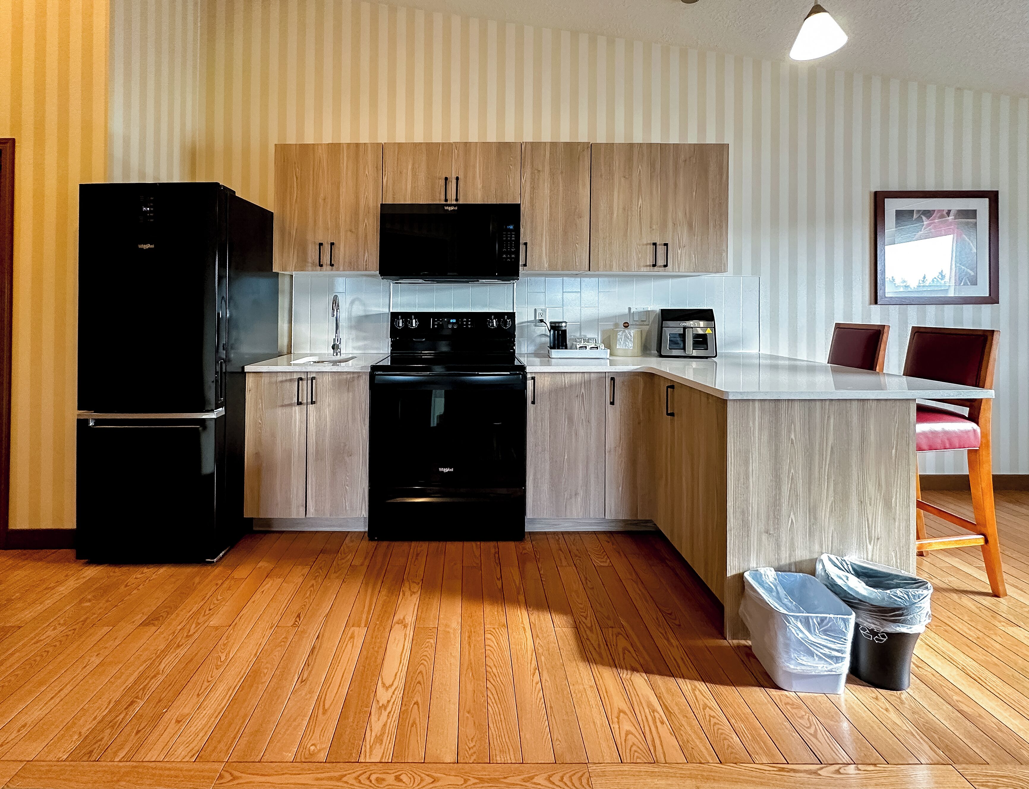 superior room, 1 king bed, jetted tub | private kitchen | coffee/tea maker