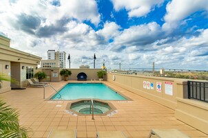 Outdoor pool, open 8:00 AM to 10:00 PM, sun loungers