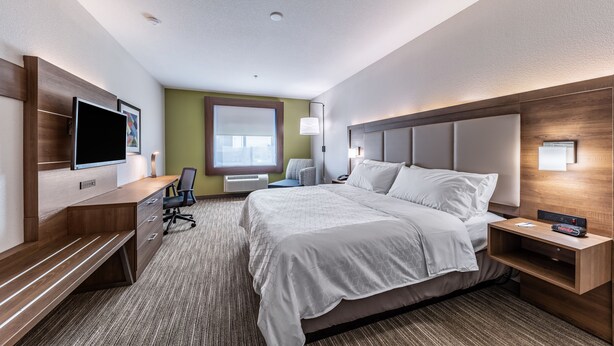 A hotel room with a bed, a desk, a chair, a TV, and a window. - Holiday Inn Express & Suites Fort Worth - Fossil Creek by IHG (Fort Worth)