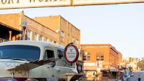 A vintage car with a beer advertisement on the windshield. - Holiday Inn Express & Suites Fort Worth - Fossil Creek by IHG (Fort Worth)