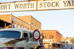 A vintage car with a beer advertisement on the windshield. - Holiday Inn Express & Suites Fort Worth - Fossil Creek by IHG (Fort Worth)