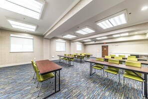A conference room with tables and chairs, large windows, and a patterned carpet. - Holiday Inn Express & Suites Fort Worth - Fossil Creek by IHG (Fort Worth)