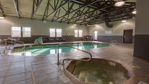 An indoor swimming pool with a hot tub, tiled flooring, and a high ceiling with beams. - Drury Inn & Suites Las Cruces (Las Cruces)
