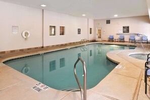A swimming pool with a no diving sign, pool rules poster, and a lifebuoy. - La Quinta Inn & Suites by Wyndham Ruidoso Downs (Ruidoso Downs)