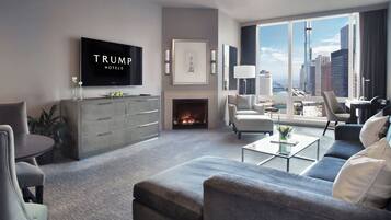 A modern living room with a flat-screen TV, a fireplace, and a city view.