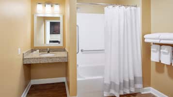 Combined shower/tub, designer toiletries, hair dryer, towels