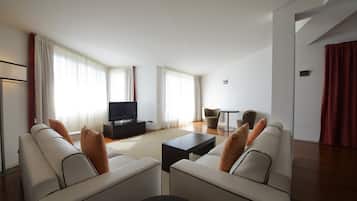 Imperial Suite with Balcony | Living room | 55-inch TV with satellite channels, pay movies