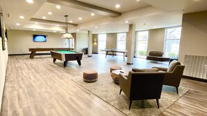A spacious indoor area with a pool table, billiards, and seating. - Candlewood Suites Bowling Green by IHG (Bowling Green)