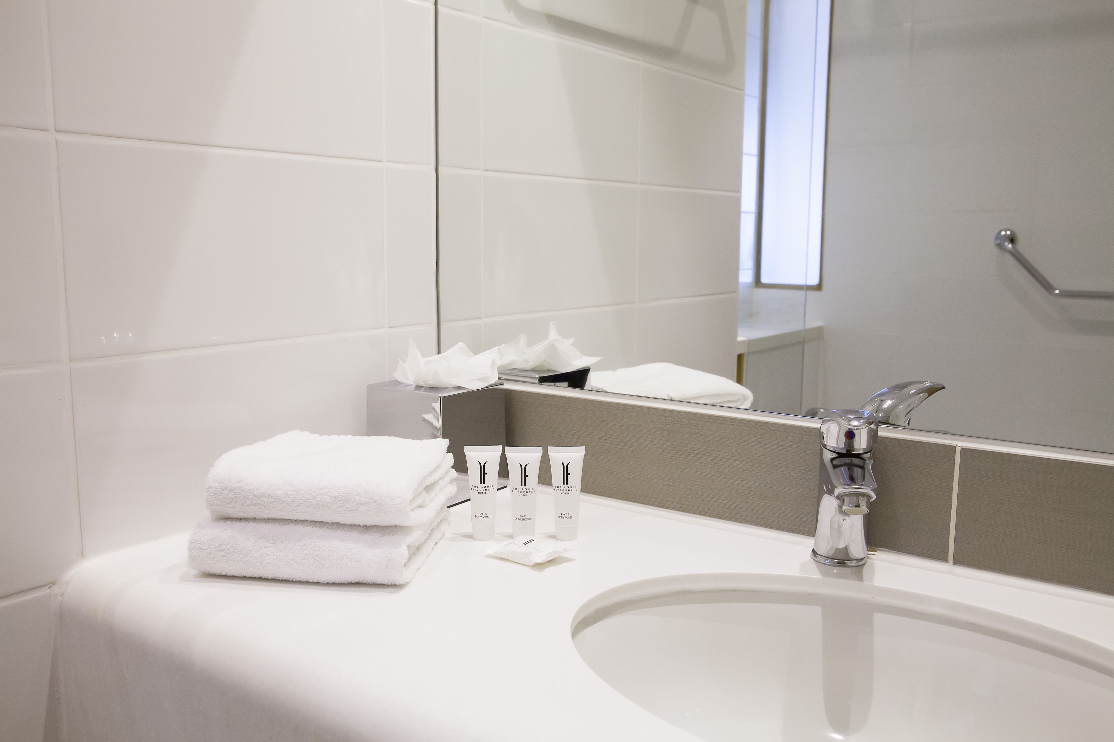 shower, designer toiletries, hair dryer, towels