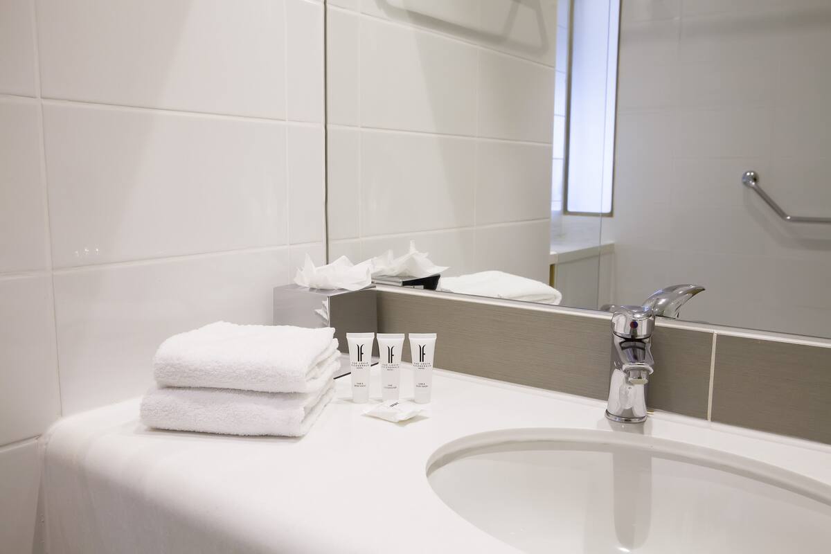 shower, designer toiletries, hair dryer, towels