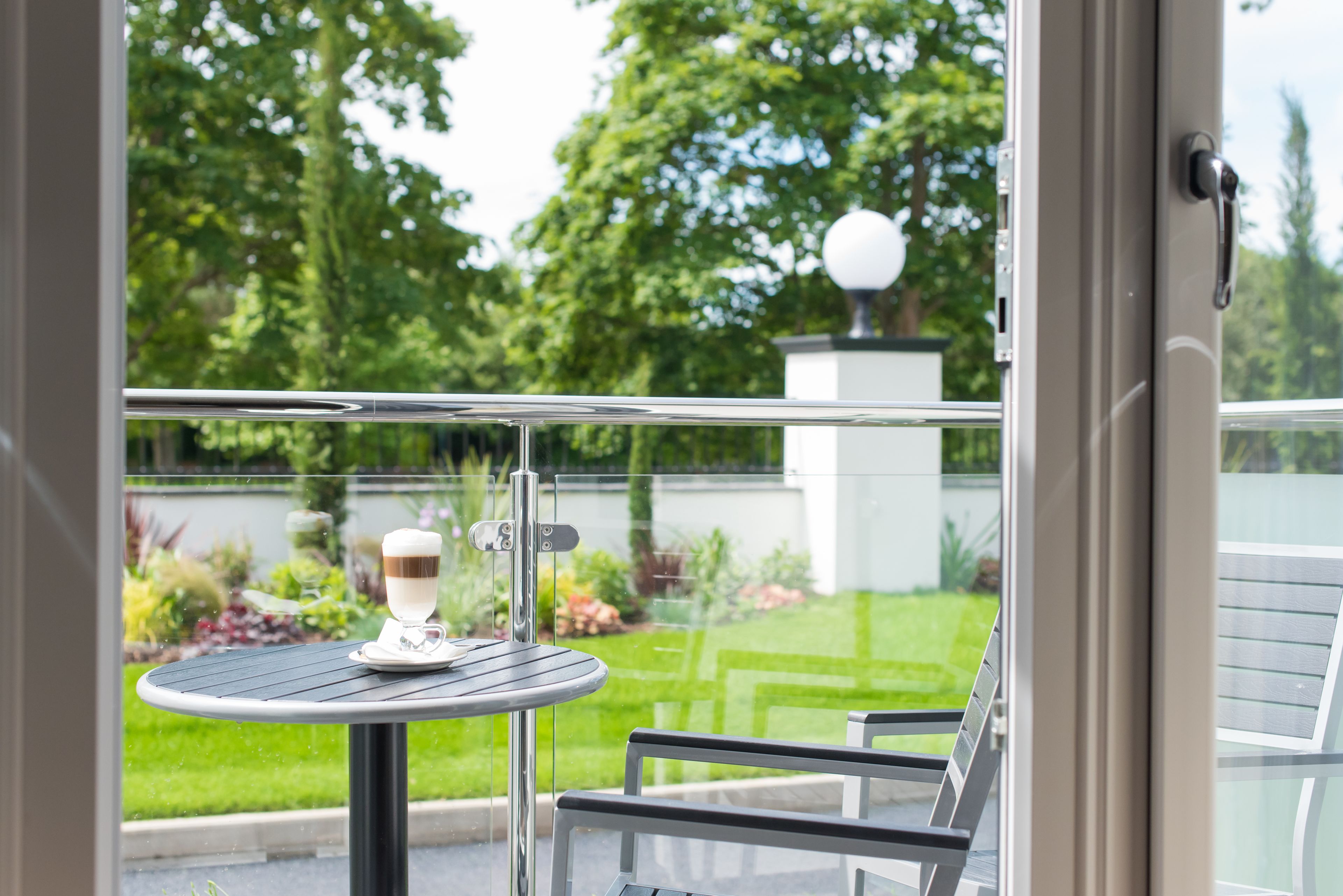 deluxe double or twin room, 1 double bed with sofa bed, balcony, garden view | view from room