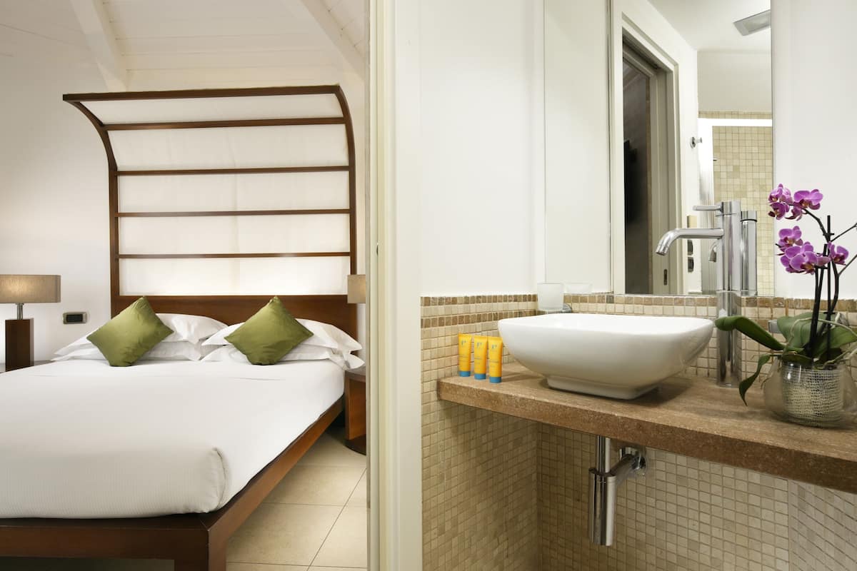 Designer toiletries, hair dryer, bathrobes, slippers