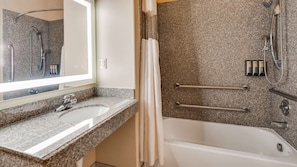 Combined shower/tub, designer toiletries, hair dryer, towels