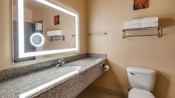 Combined shower/tub, designer toiletries, hair dryer, towels
