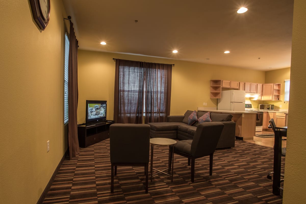 suite, 1 king bed with sofa bed | living area | 36-inch tv with cable channels, dvd player