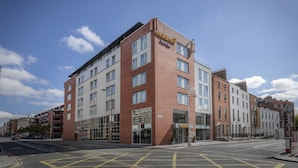 A modern hotel with a prominent 'Maldron Hotel' sign, large windows, and a corner location with a street view. - Maldron Hotel Parnell Square Dublin City (Dublin)