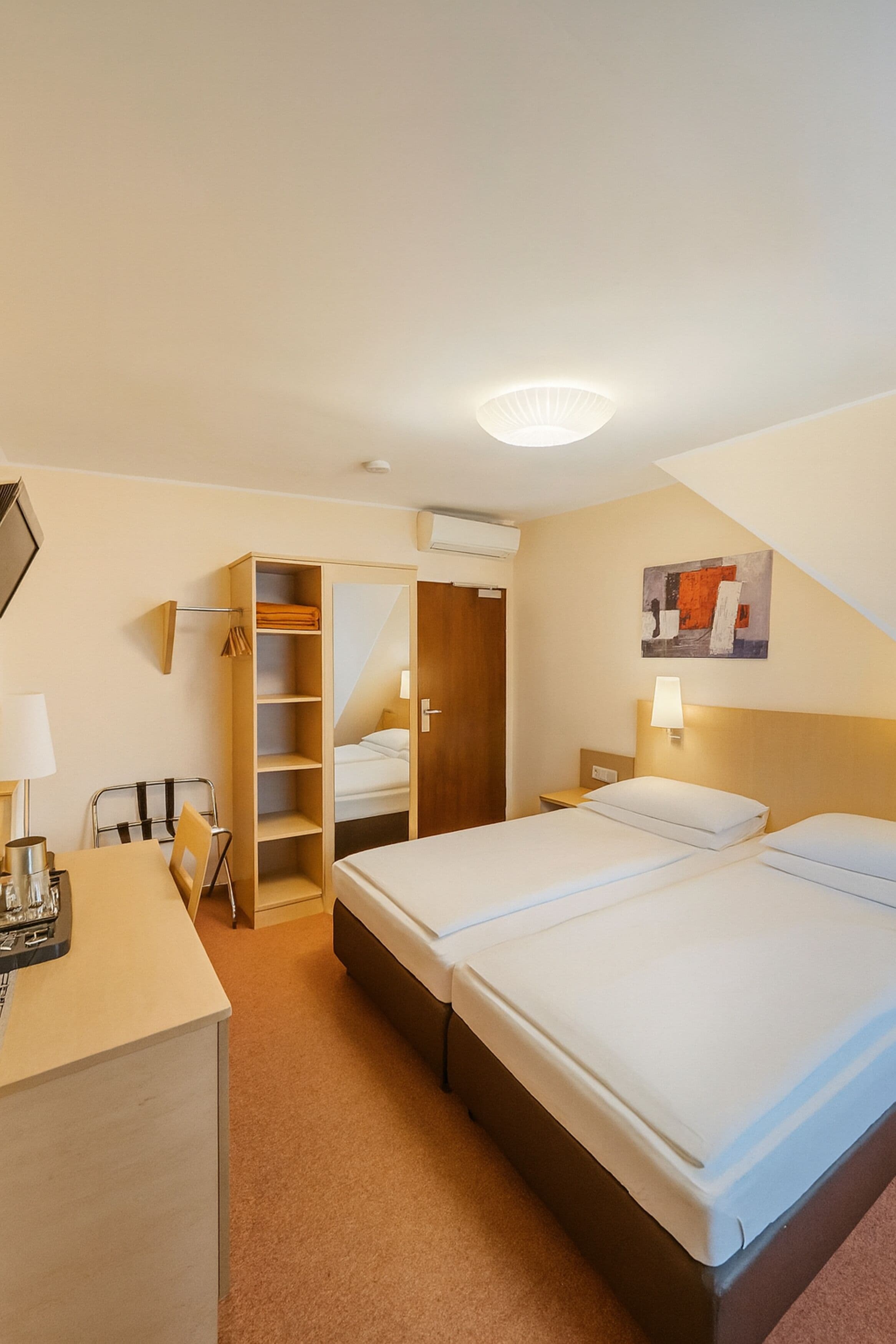 Double Room, Air conditioning | Minibar, in-room safe, desk, blackout curtains