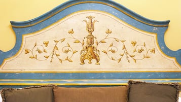 A headboard with a decorative design and two pillows.