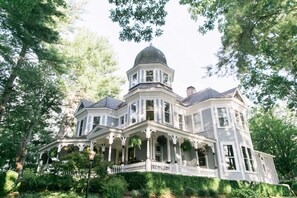 A large, white, two-story house with a prominent tower and multiple windows. - Biltmore Village Inn B&B (Asheville)