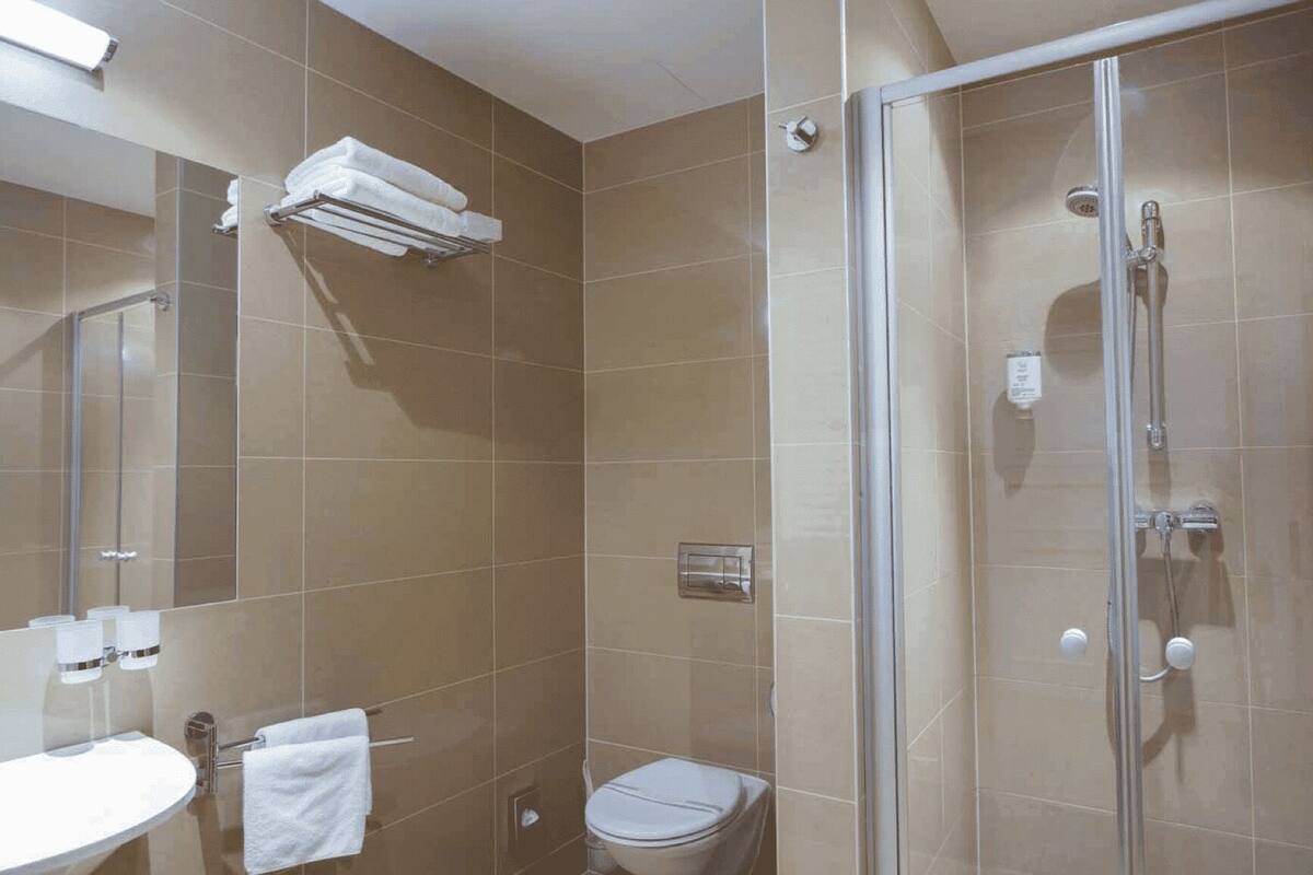 family room | bathroom | shower, free toiletries, hair dryer, towels