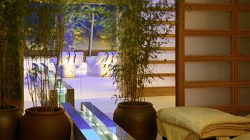 Experience serenity in this tranquil space, featuring a serene water feature, lush greenery, and a cozy seating area.