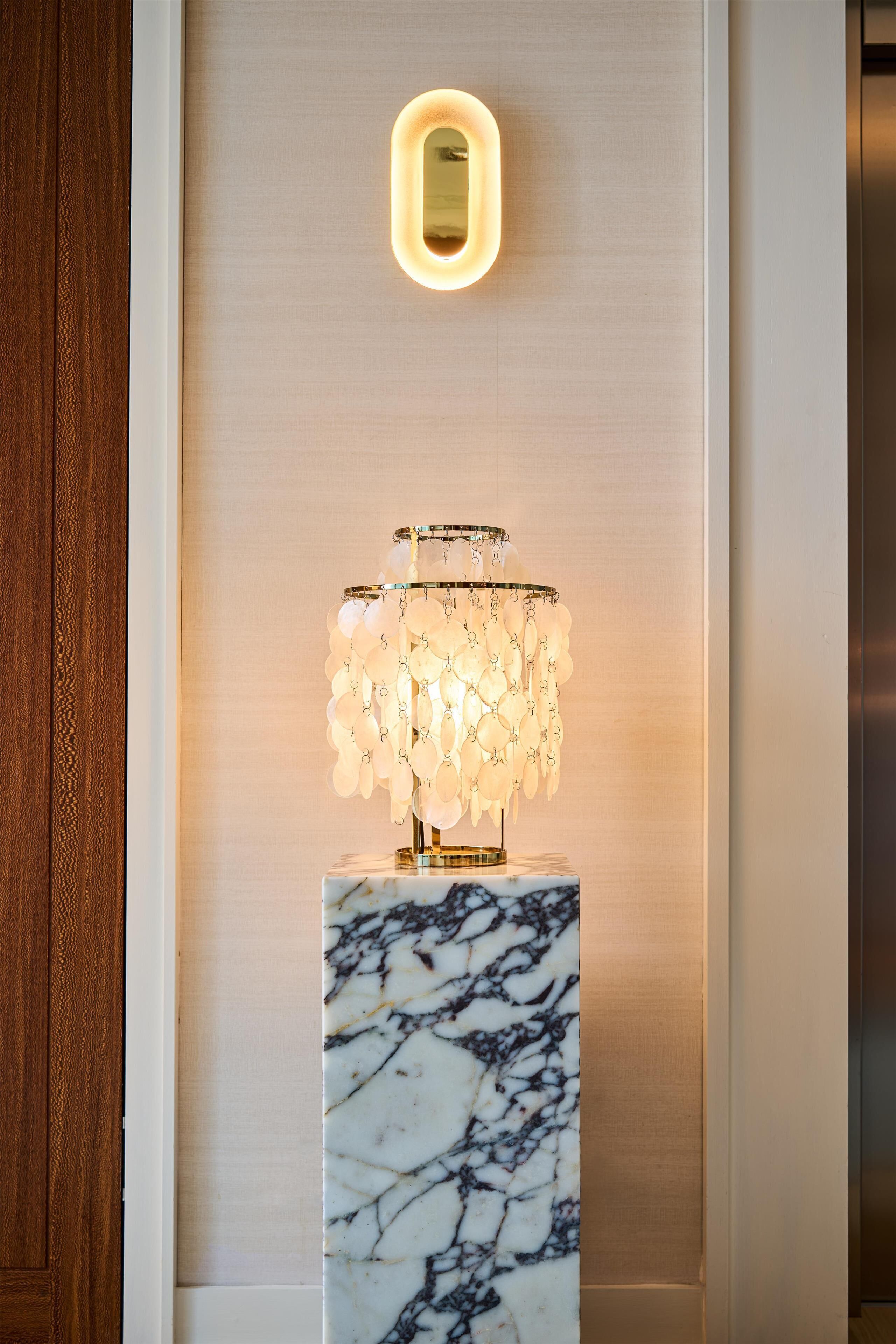 A marble pedestal with a chandelier.