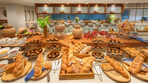 A buffet with a variety of breads and pastries. - Deevana Plaza Phuket (Patong)
