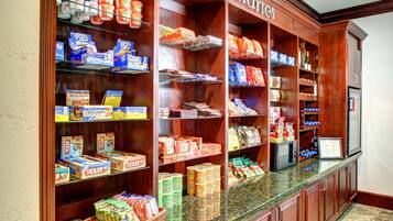 A self-service food station with various packaged goods and snacks.