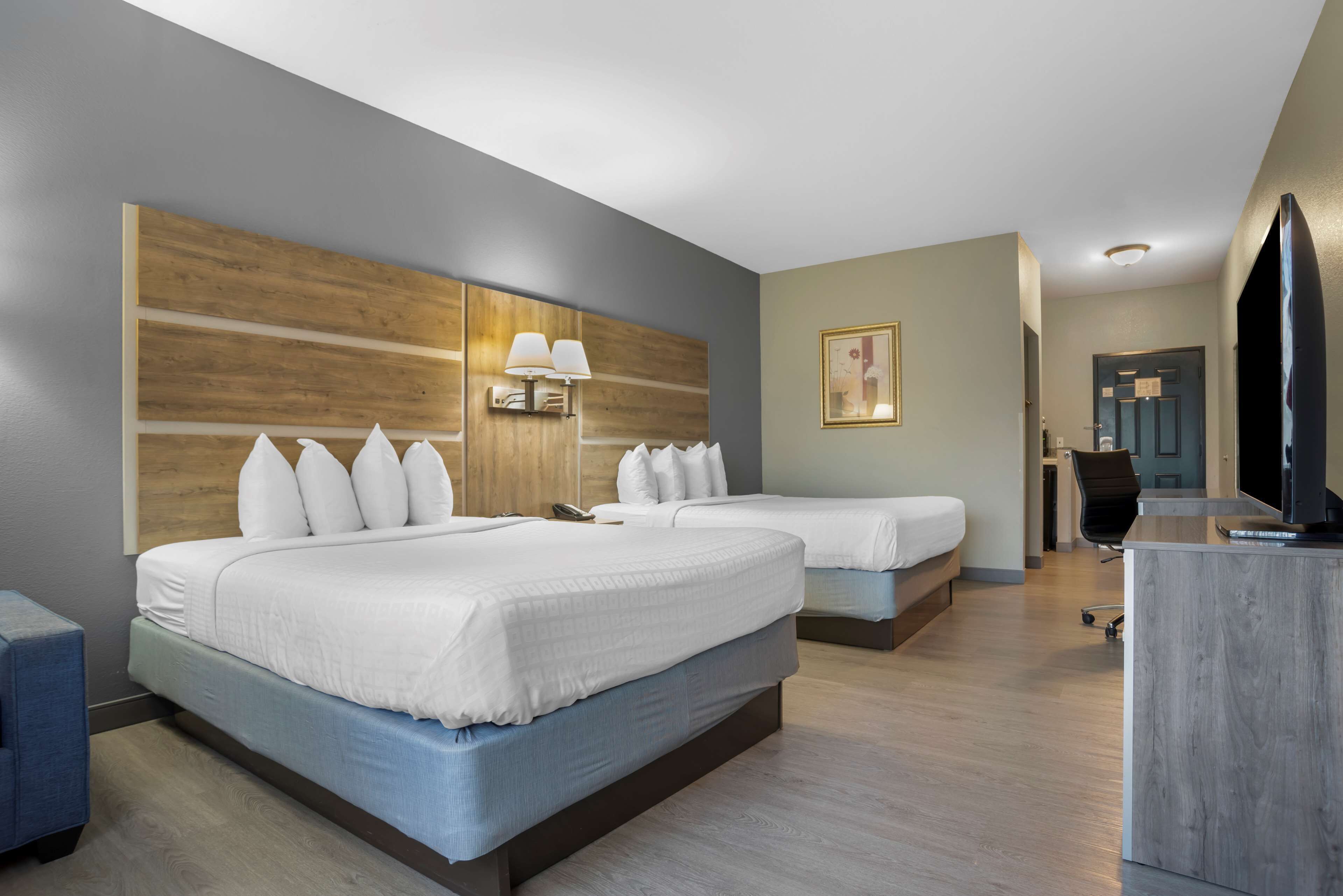 standard room, 2 queen beds, non smoking, refrigerator & microwave | premium bedding, desk, laptop workspace, blackout curtains