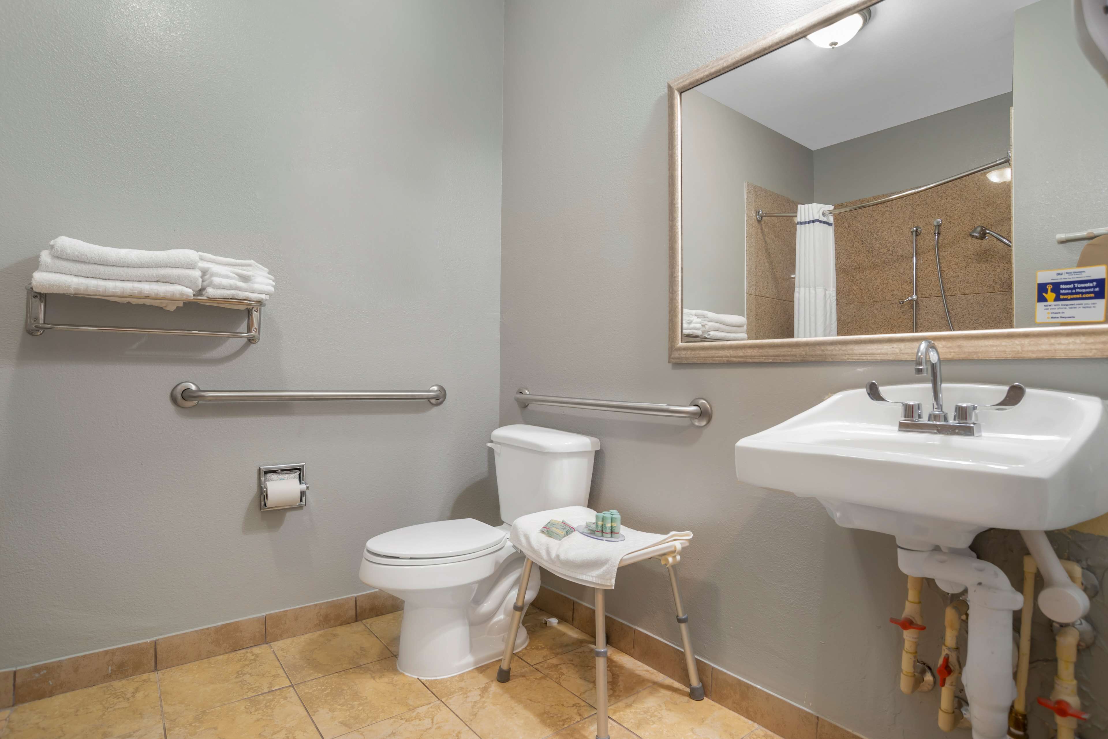 combined shower/bathtub, designer toiletries, hair dryer, towels