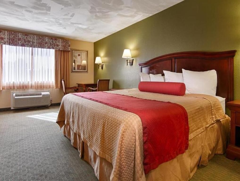 Premium bedding, desk, laptop workspace, blackout curtains