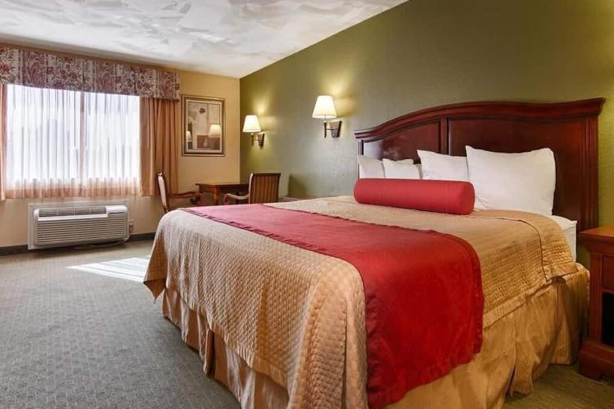 Premium bedding, desk, laptop workspace, blackout curtains