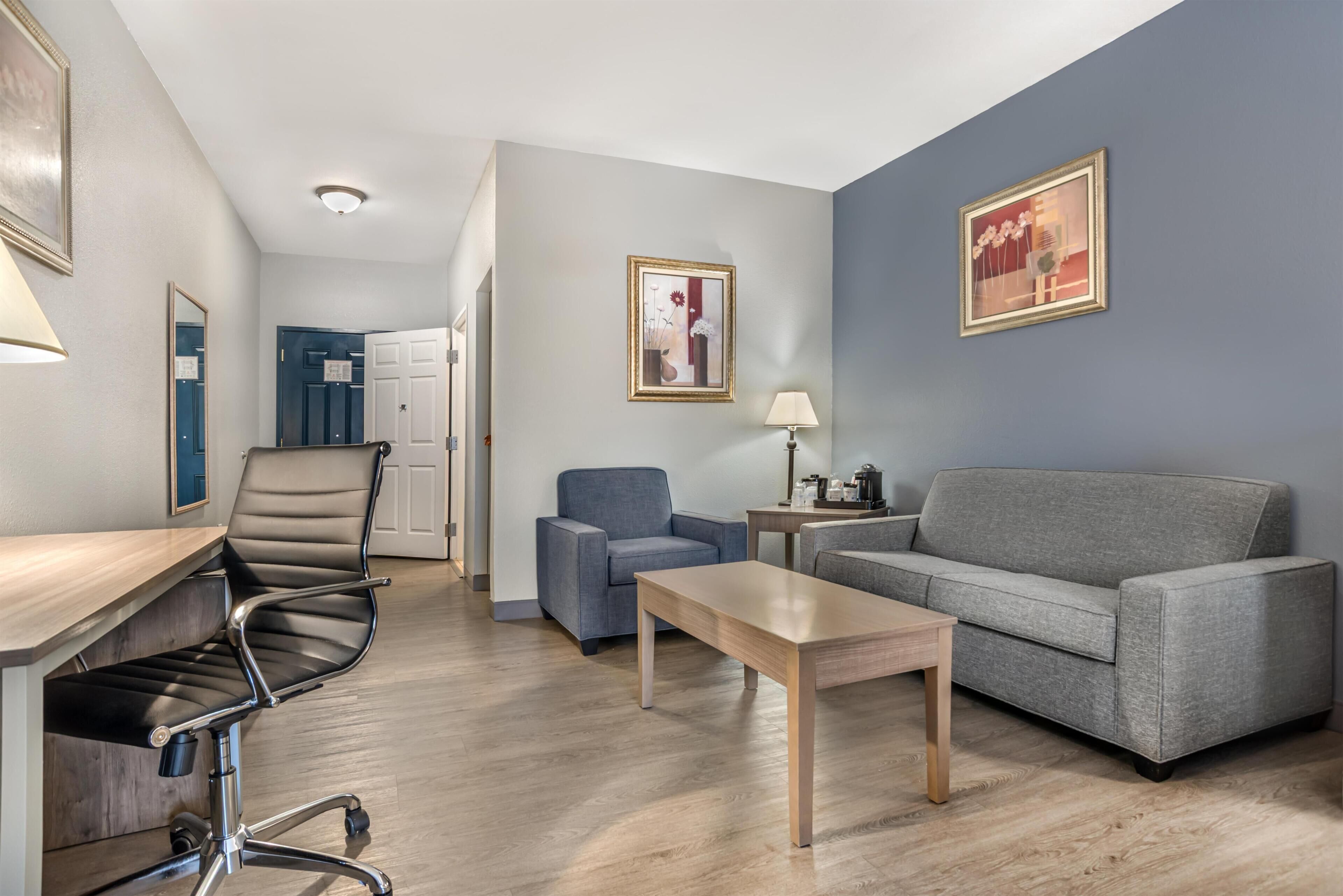 Premium bedding, desk, laptop workspace, blackout curtains