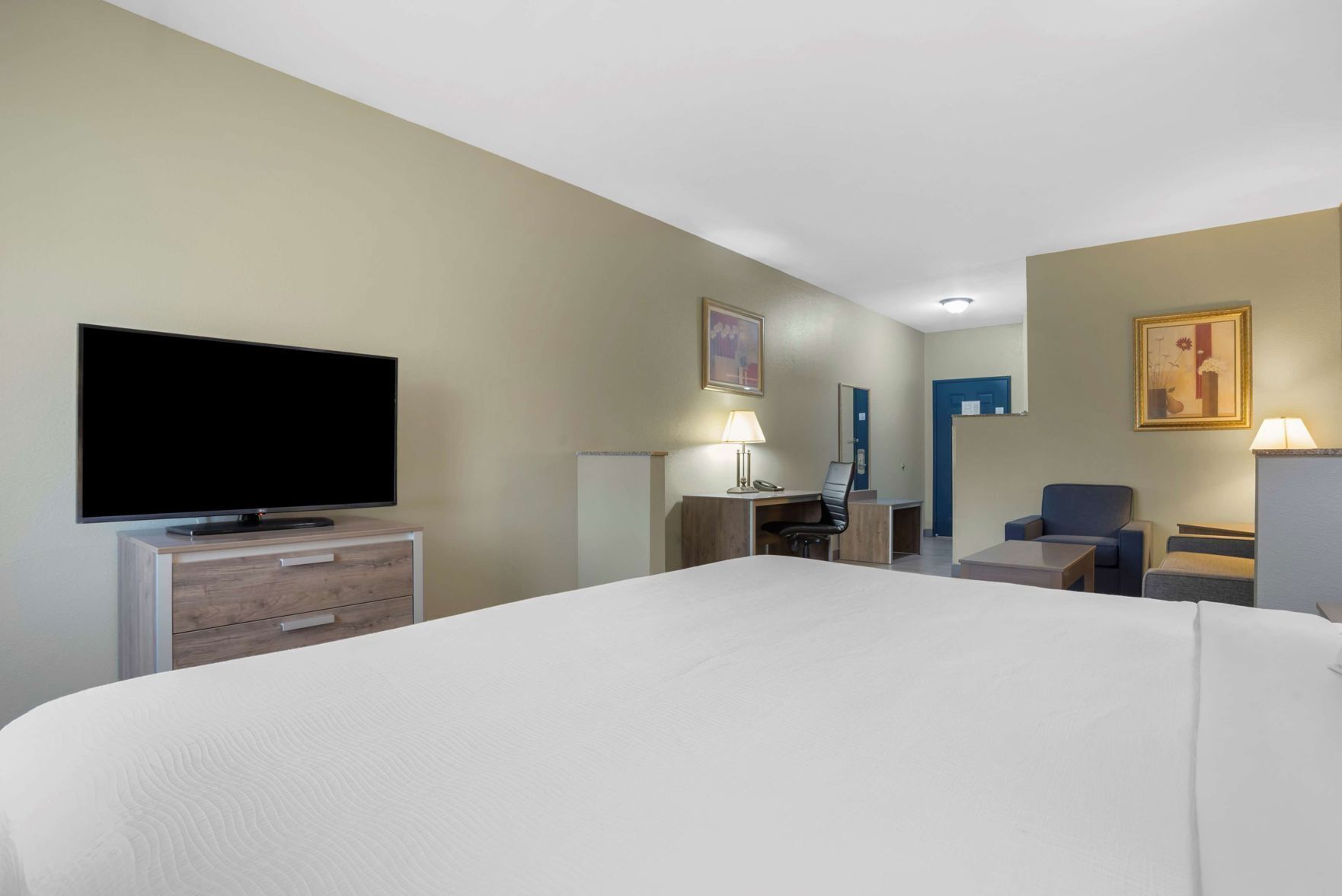 Premium bedding, desk, laptop workspace, blackout curtains