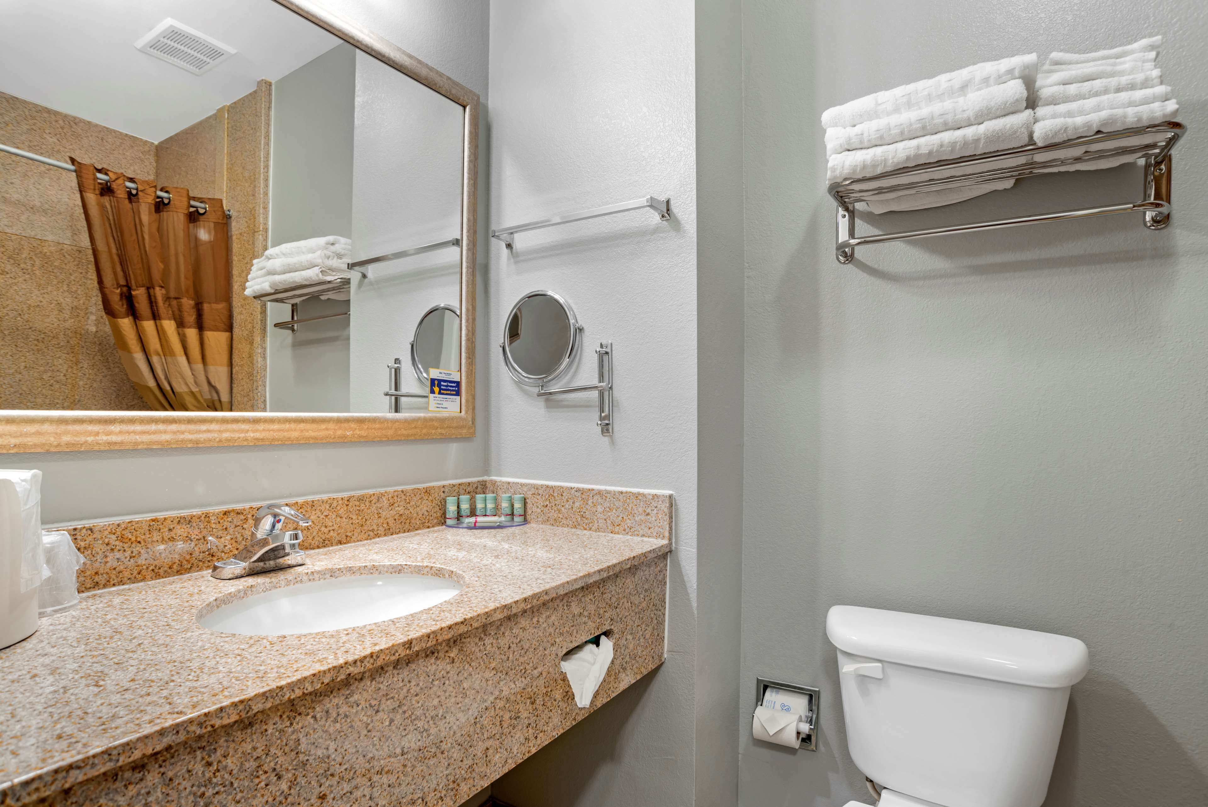 combined shower/bathtub, designer toiletries, hair dryer, towels