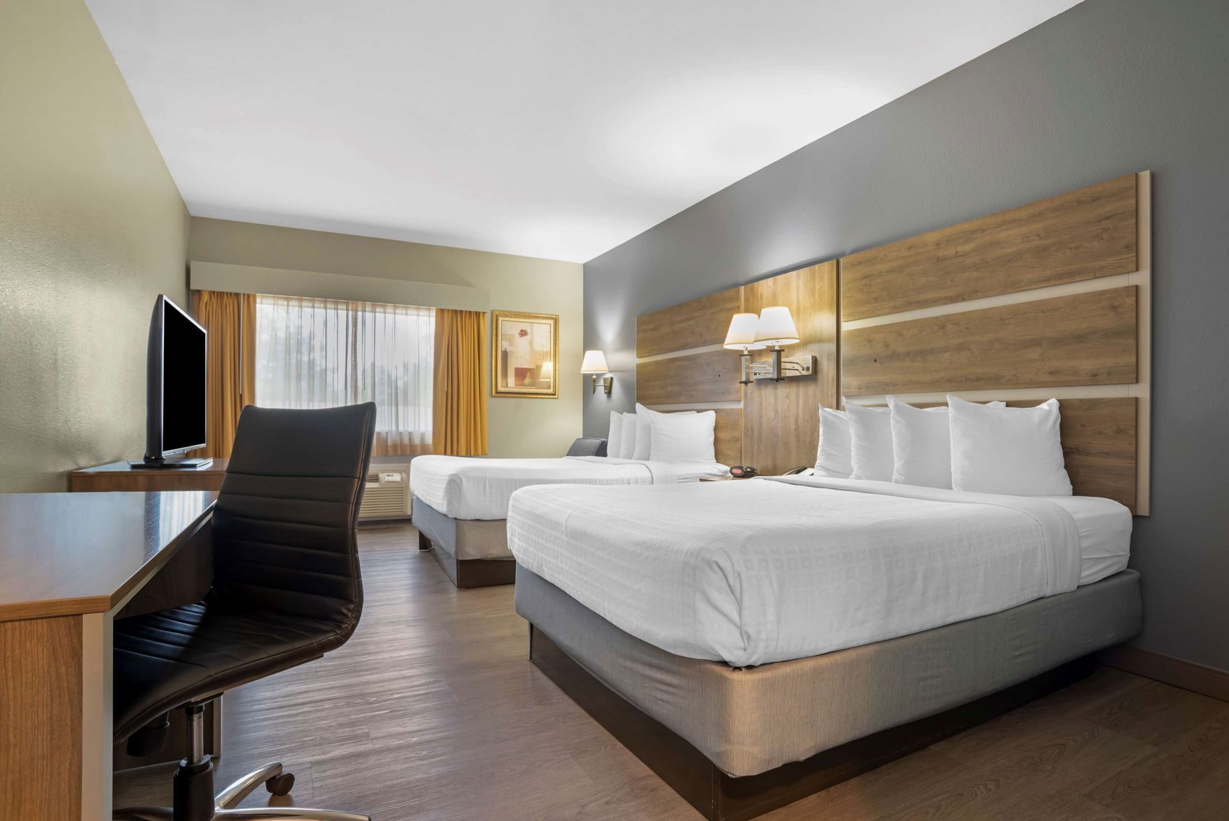 Premium bedding, desk, laptop workspace, blackout curtains