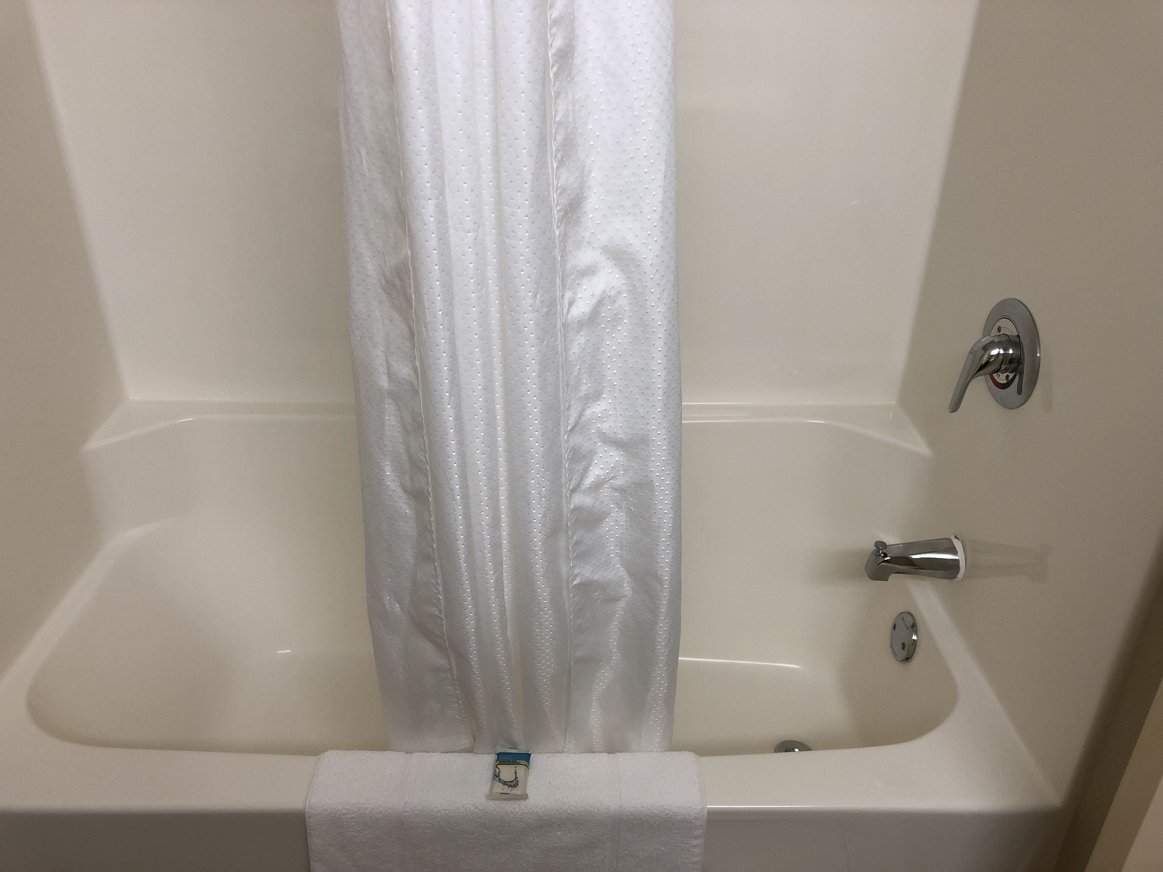 combined shower/bathtub, free toiletries, hair dryer, towels