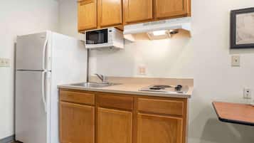Full-size fridge, microwave, stovetop, freezer