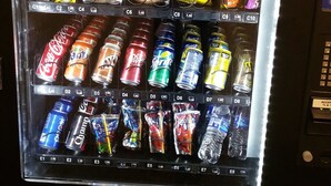 A vending machine stocked with various snacks and drinks. - WoodSpring Suites Charlotte Shelby (Shelby)