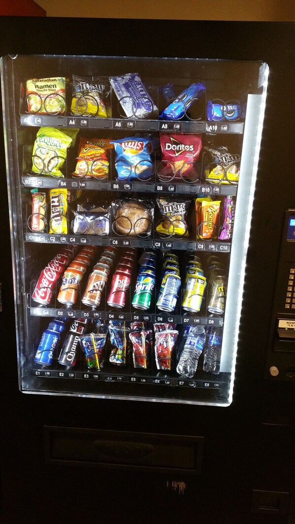 A vending machine stocked with various snacks and drinks.