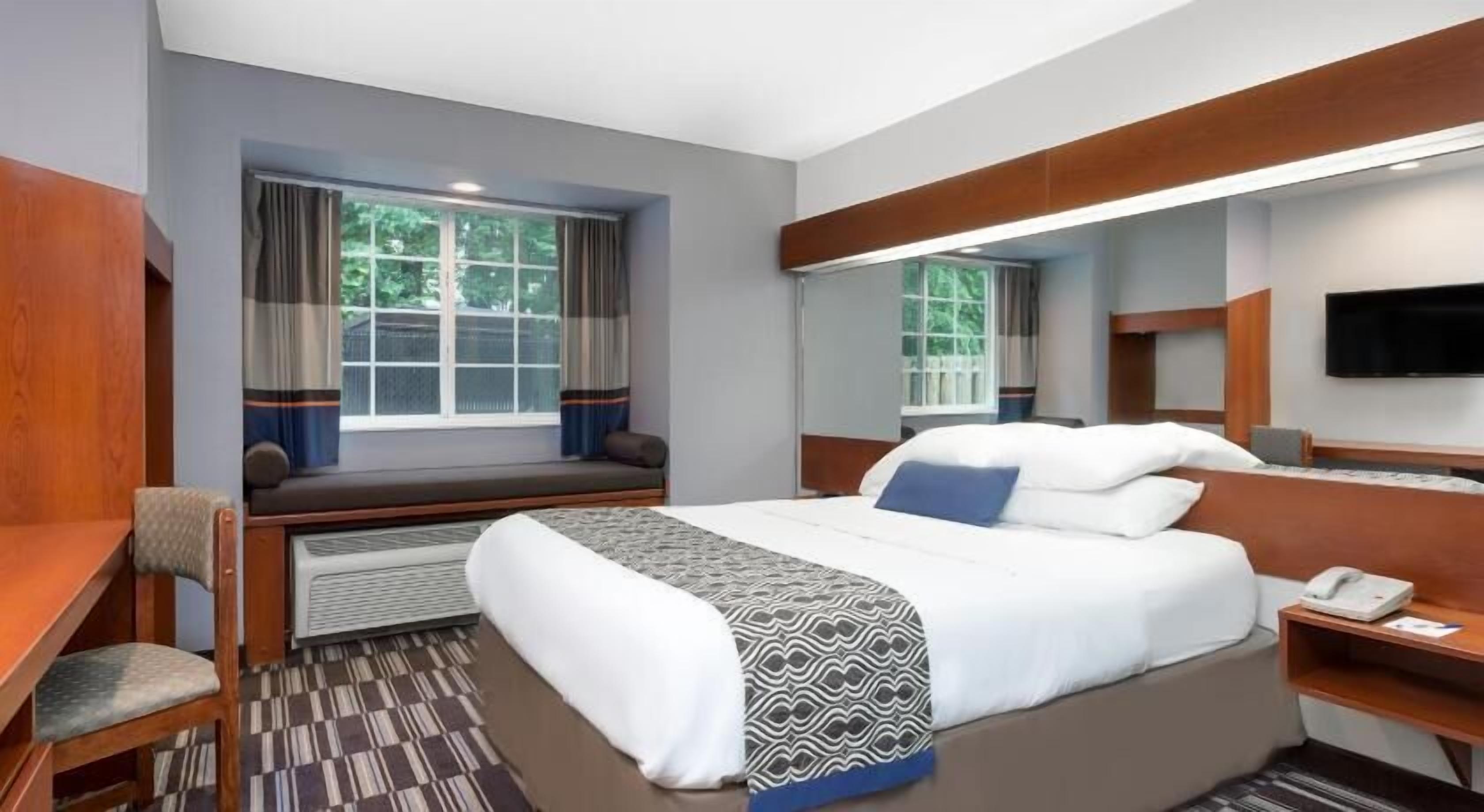 Premium bedding, desk, blackout drapes, iron/ironing board