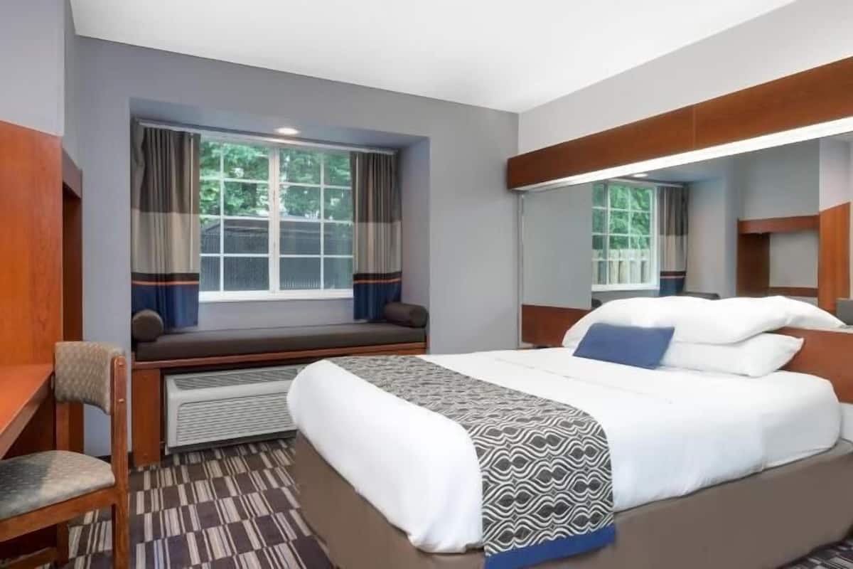 Premium bedding, desk, blackout drapes, iron/ironing board