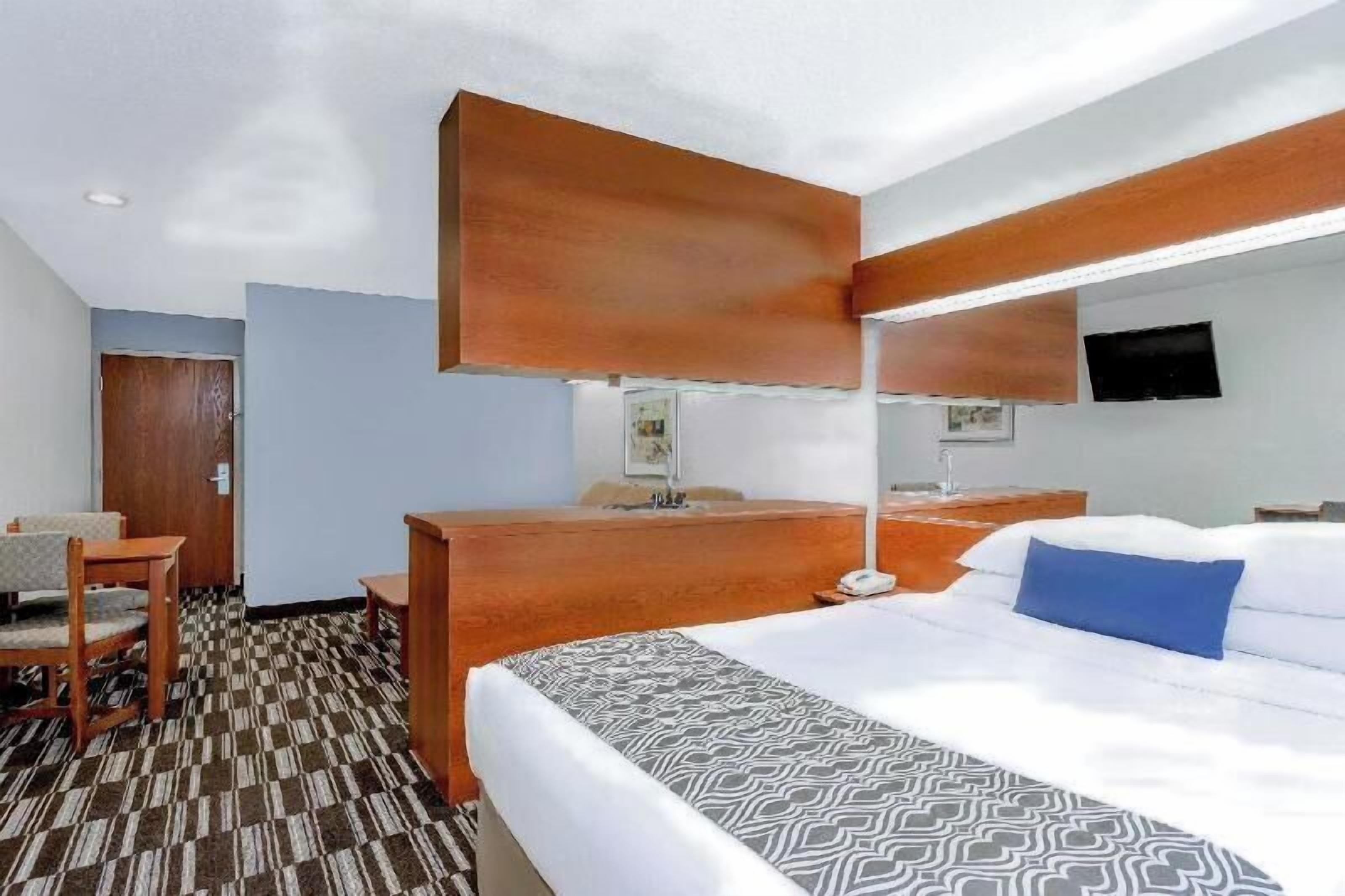 Premium bedding, desk, blackout drapes, iron/ironing board