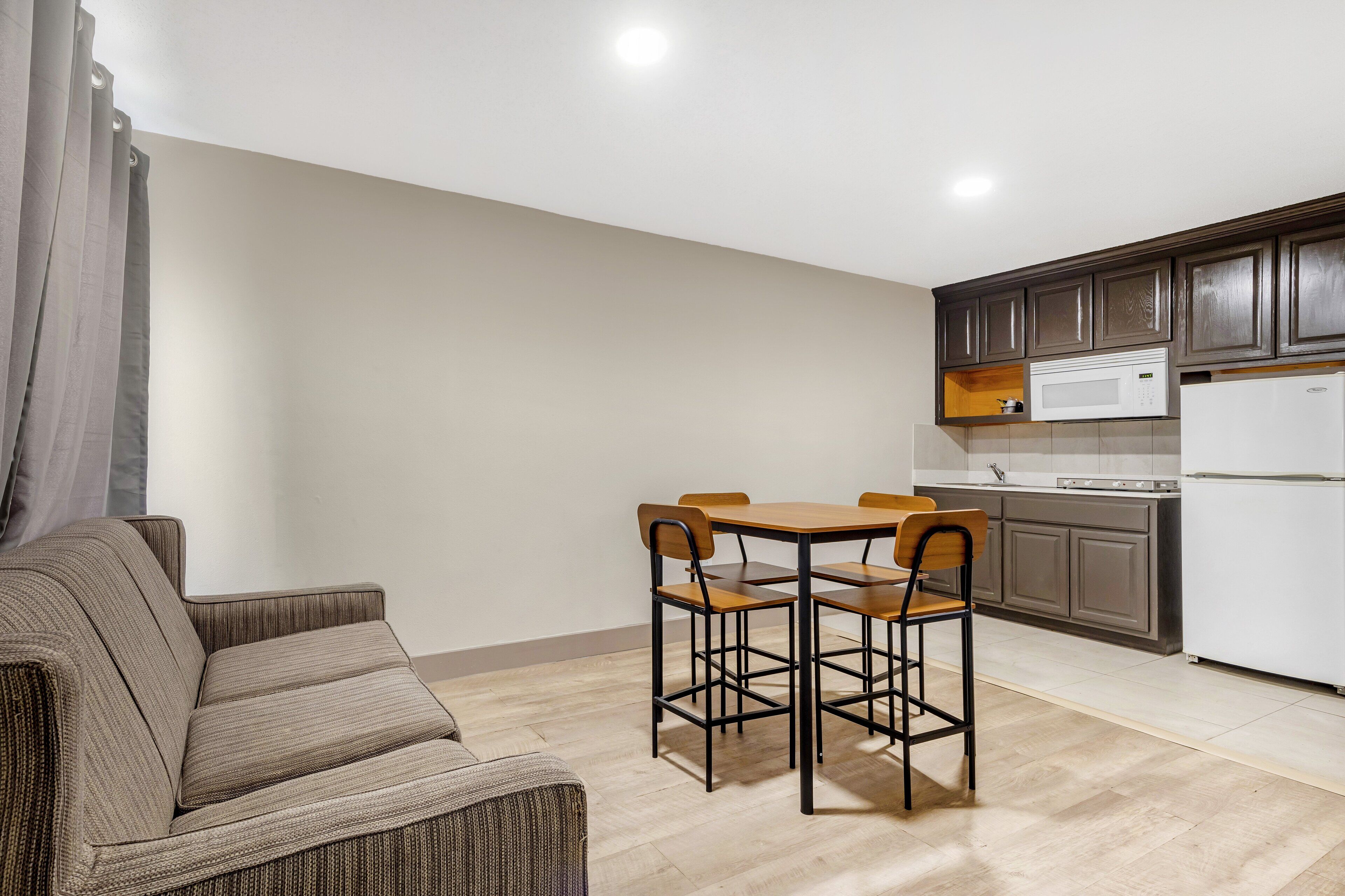 Suite, 1 King Bed, Non Smoking, Kitchenette | Desk, laptop workspace, blackout curtains, free WiFi