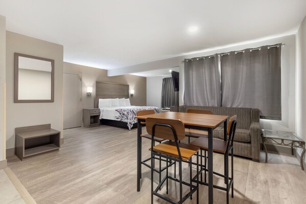 Suite, 1 King Bed, Non Smoking, Kitchenette | Desk, laptop workspace, blackout drapes, free WiFi