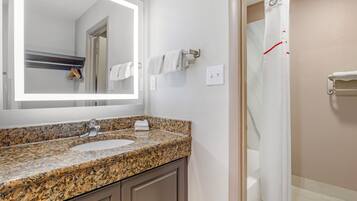Combined shower/tub, towels, soap, shampoo