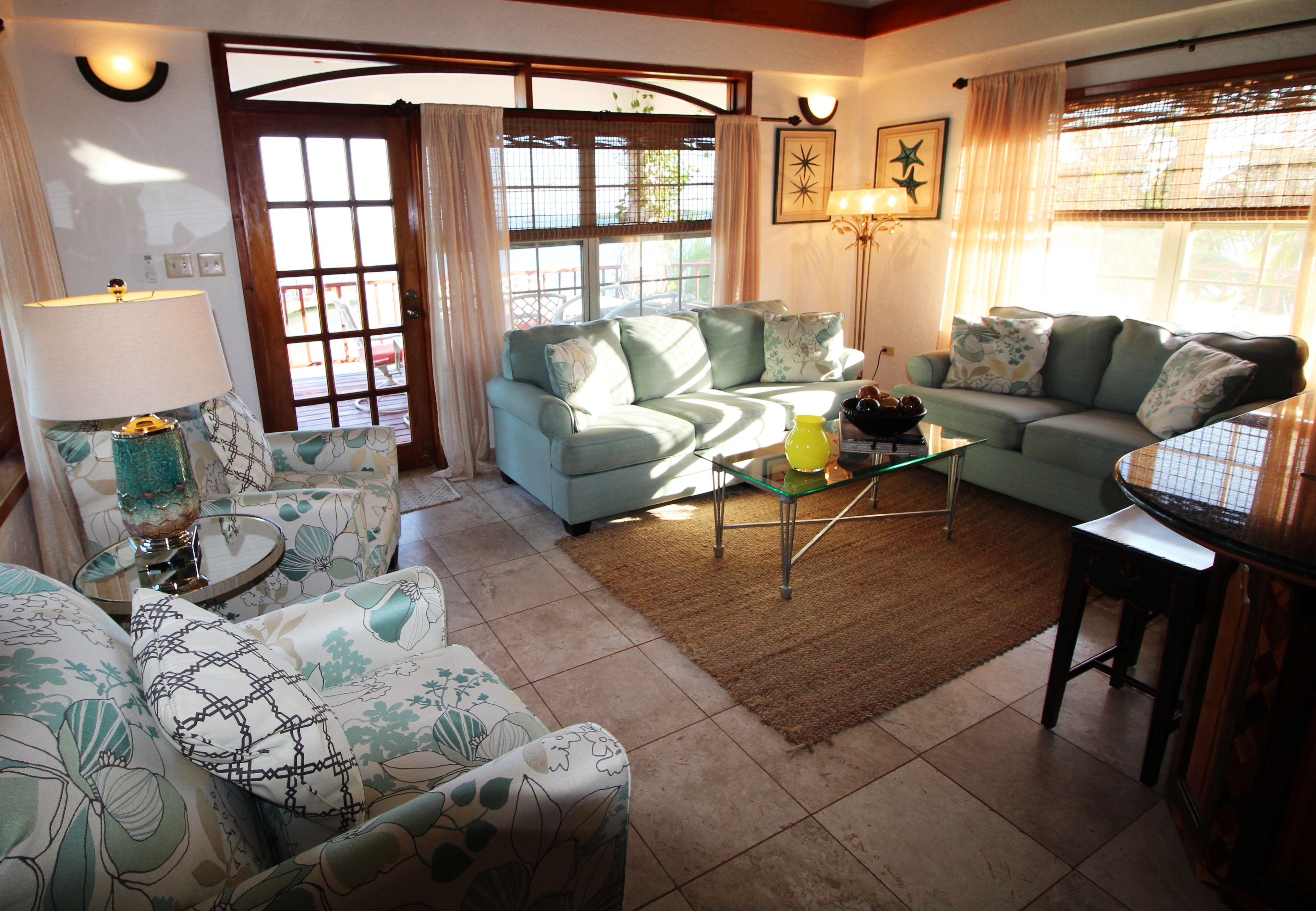 luxury villa, 2 bedrooms, oceanfront | living area | 42-inch flat-screen tv with cable channels, tv, dvd player