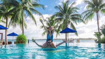 2 outdoor pools, pool umbrellas, pool loungers