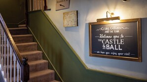A staircase with a sign indicating Rooms 4-38. - Castle And Ball by Greene King Inns (Marlborough)
